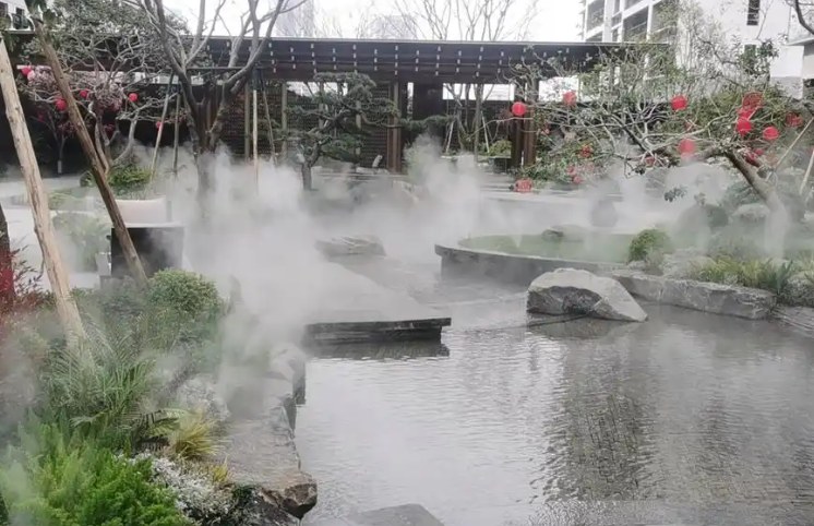 Fog system installed around an outdoor water feature